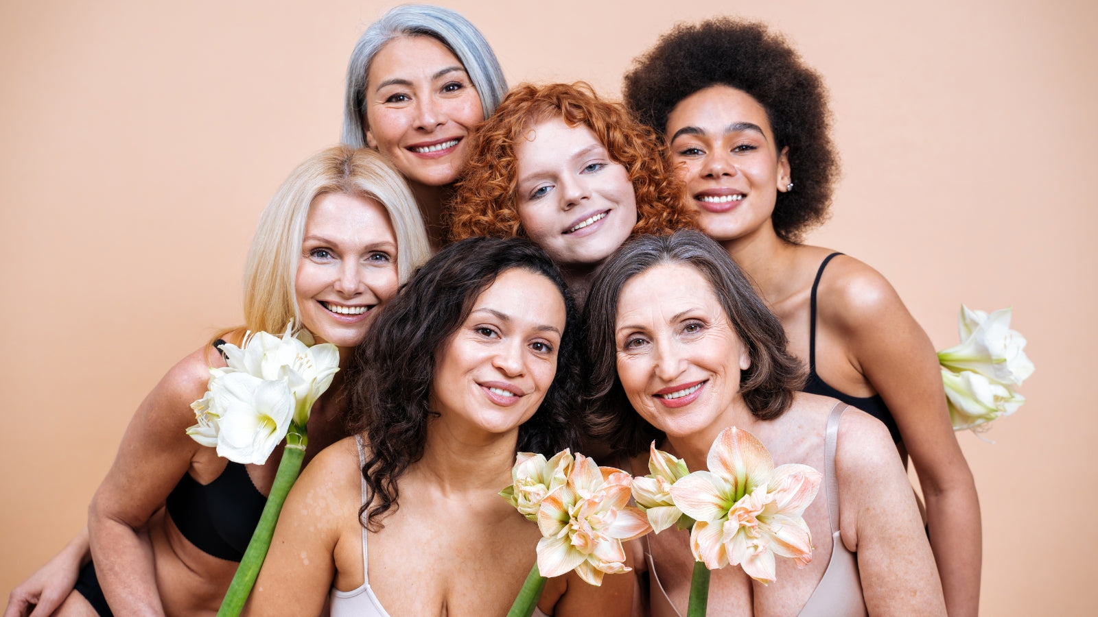 Women of different backgrounds embracing natural beauty