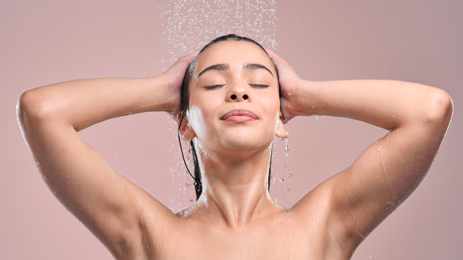 Young woman taking a refreshing shower